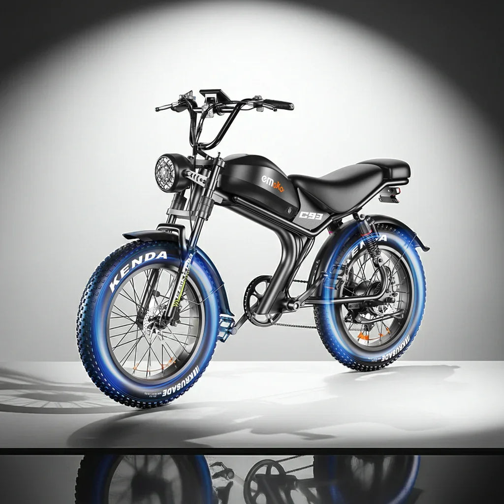 Black emoko C93 electric bike with blue Kenda fat tires in a studio spotlight.
